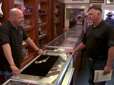 toy expert pawn stars game standing in shop